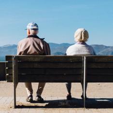 Elderly couple on bench at overlook